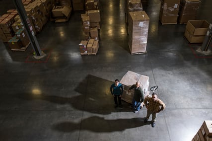 a-group-of-three-warehouse-workers-standing