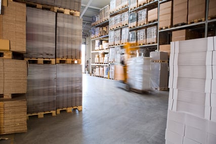 blurred-forklift-truck-in-storage-warehouse
