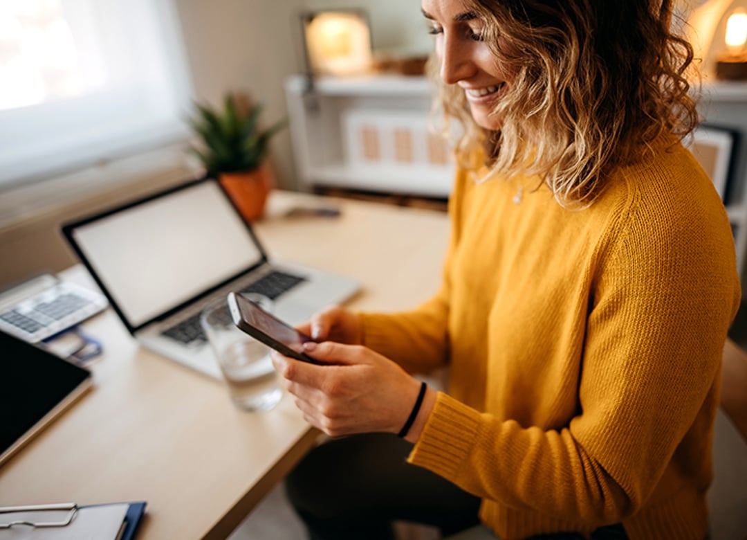 satisfied customer chatting with customer success team on mobile