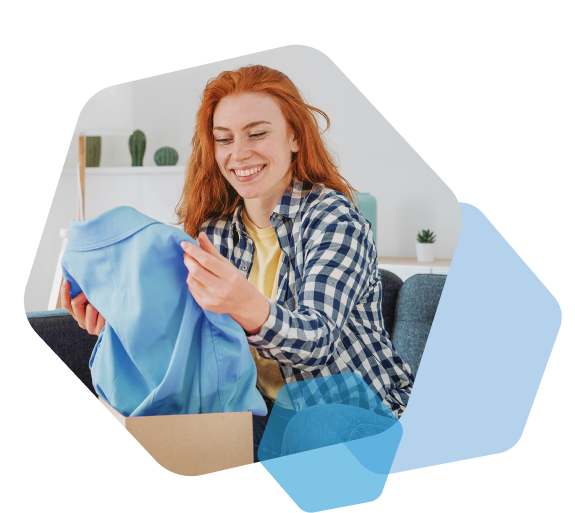 Customer receiving shirt from apparel fulfillment service