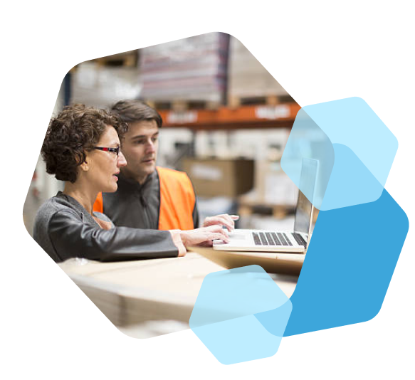 Cart.com B2B fulfillment staff using laptop in warehouse